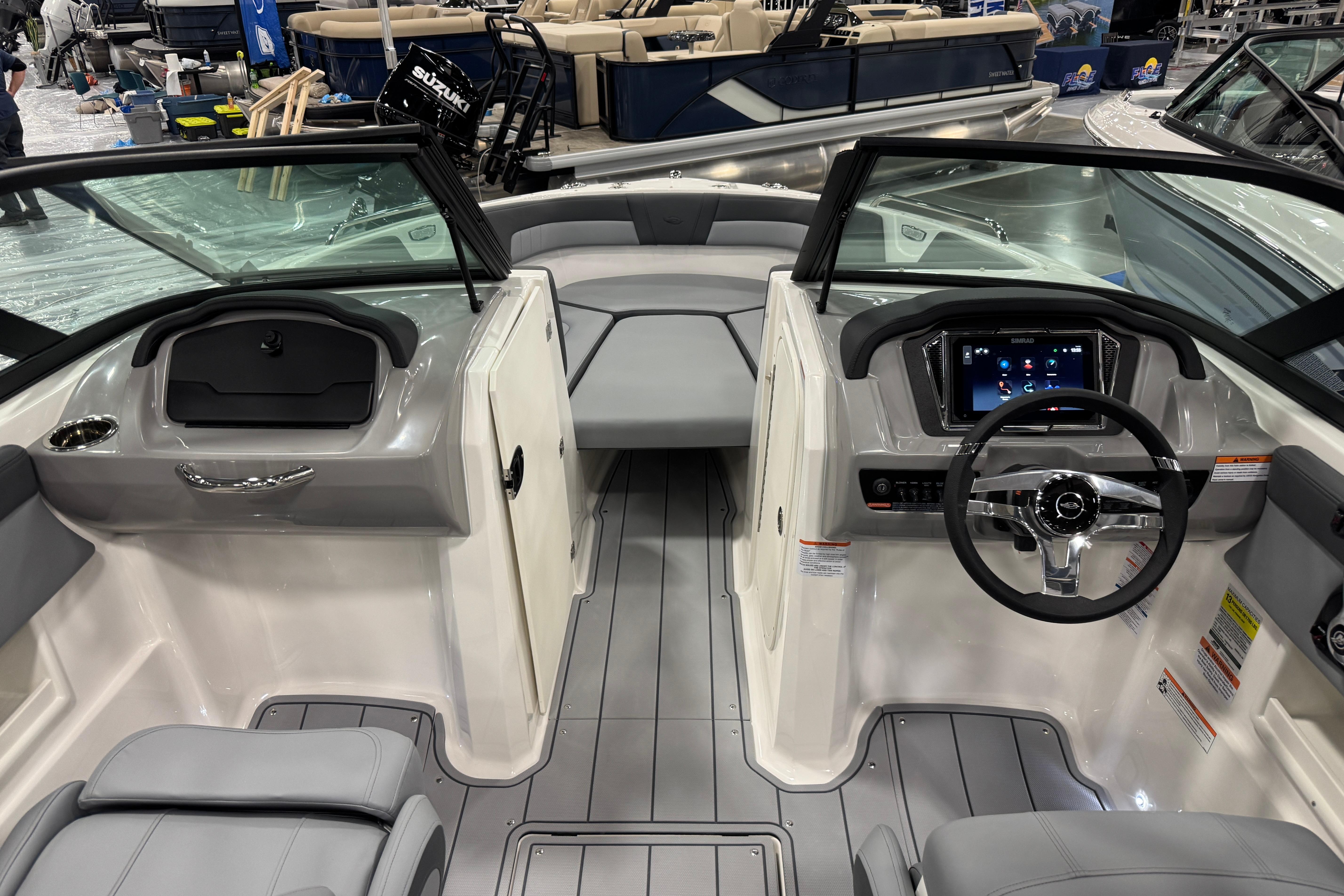 Interior view of 2026 Chaparral 23 SSi boat, featuring modern dashboard and seating.