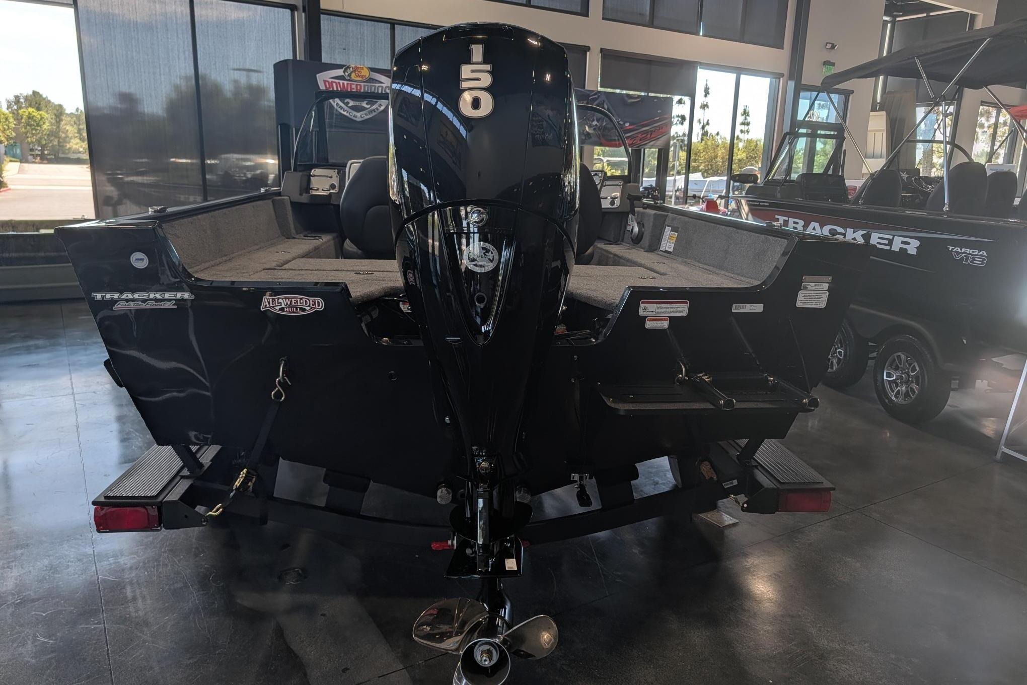 2026 Tracker Pro Guide V-175 Combo boat with 150 HP engine in showroom.