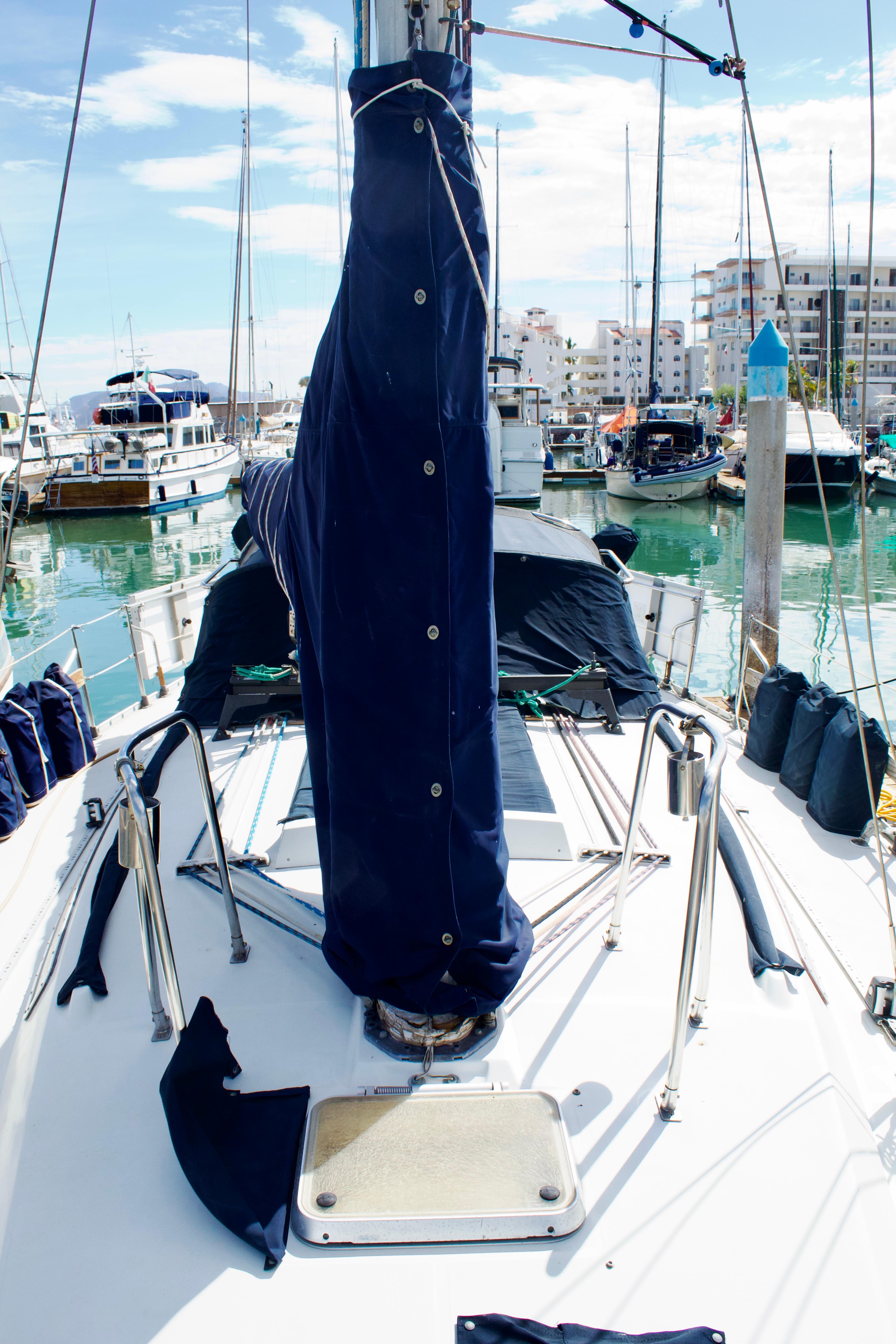 1988 Beneteau First 405 Tall Rig sailboat docked in a marina.