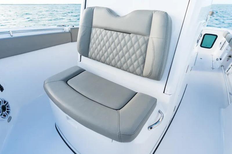 2026 Sportsman Open 282 Center Console boat with luxurious seating and ocean backdrop.