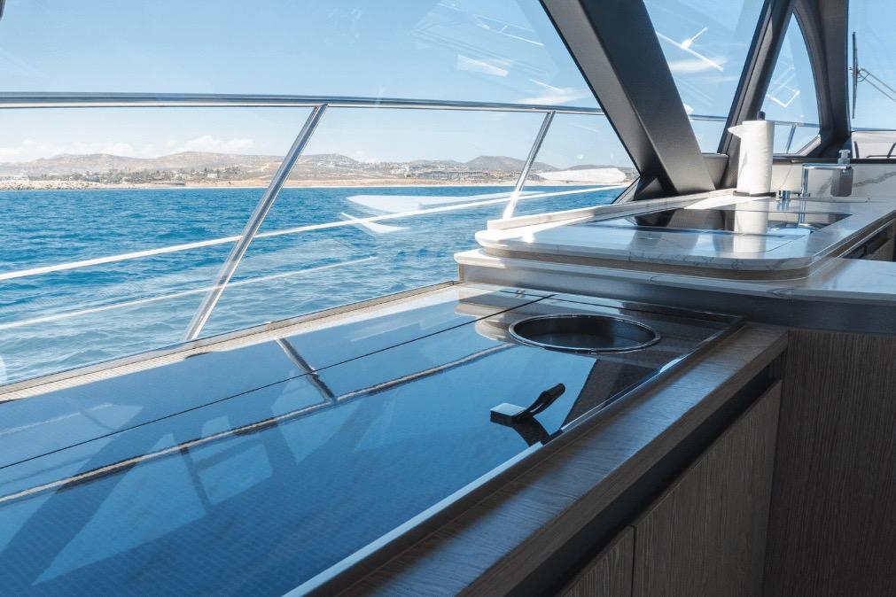 Luxurious interior of 2020 Azimut 60 yacht with ocean view through large windows.