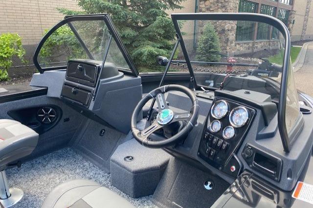 2025 Tracker Targa V-19 Combo boat interior with steering wheel and dashboard controls.