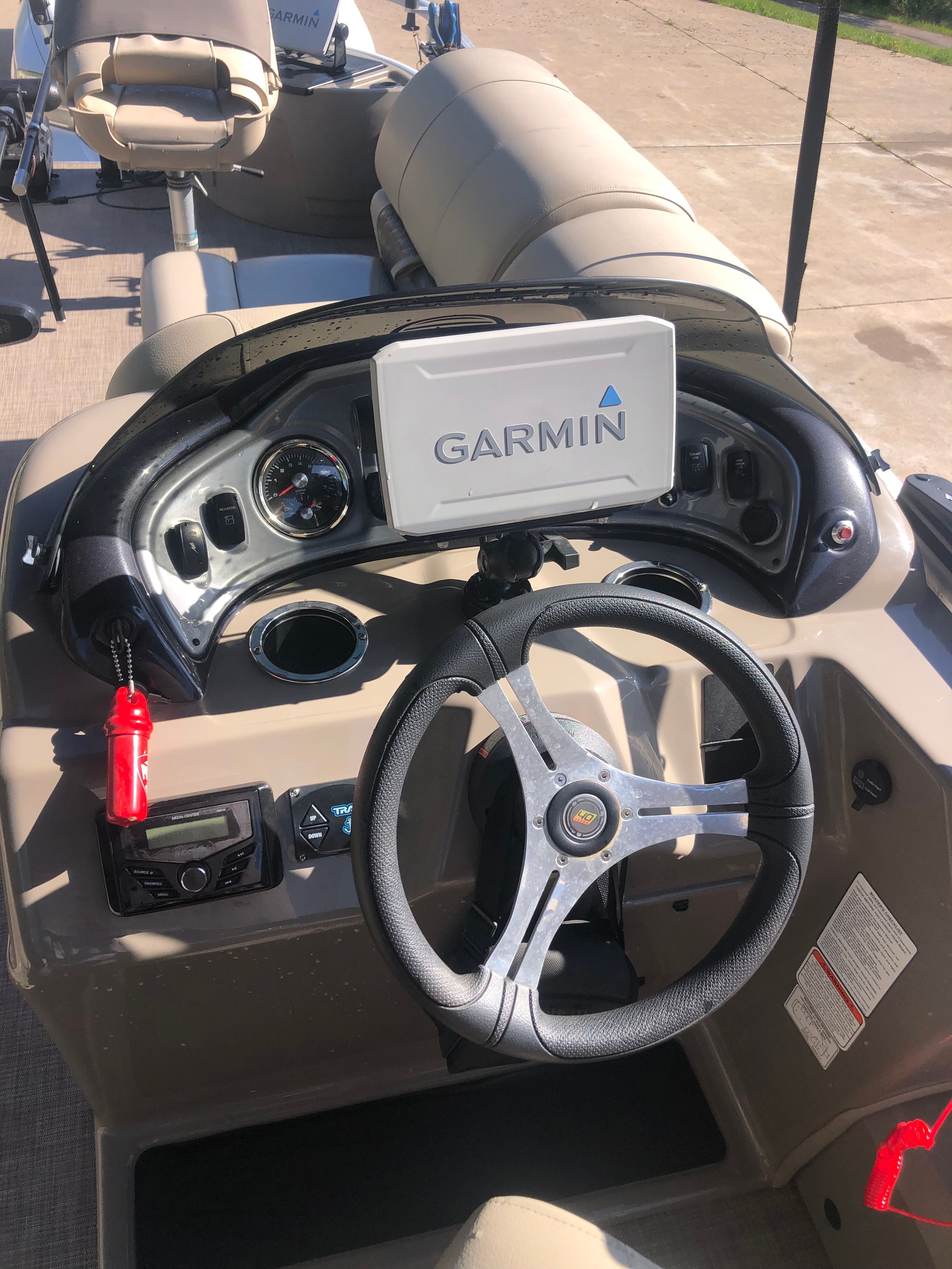 2023 Sun Tracker Fishin' Barge 22 DLX with Garmin navigation system.