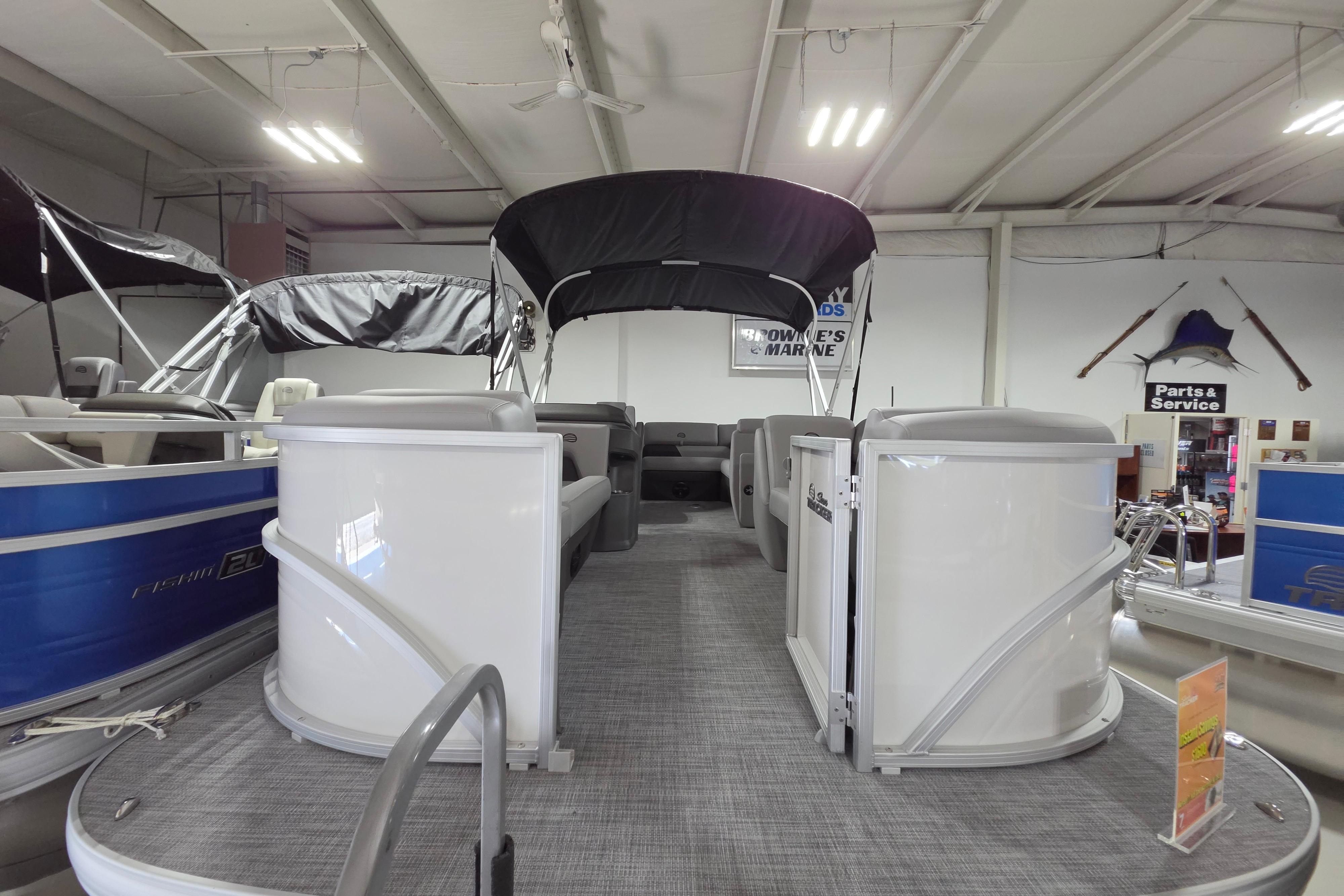 2026 Sun Tracker Party Barge 20 DLX pontoon boat displayed indoors.