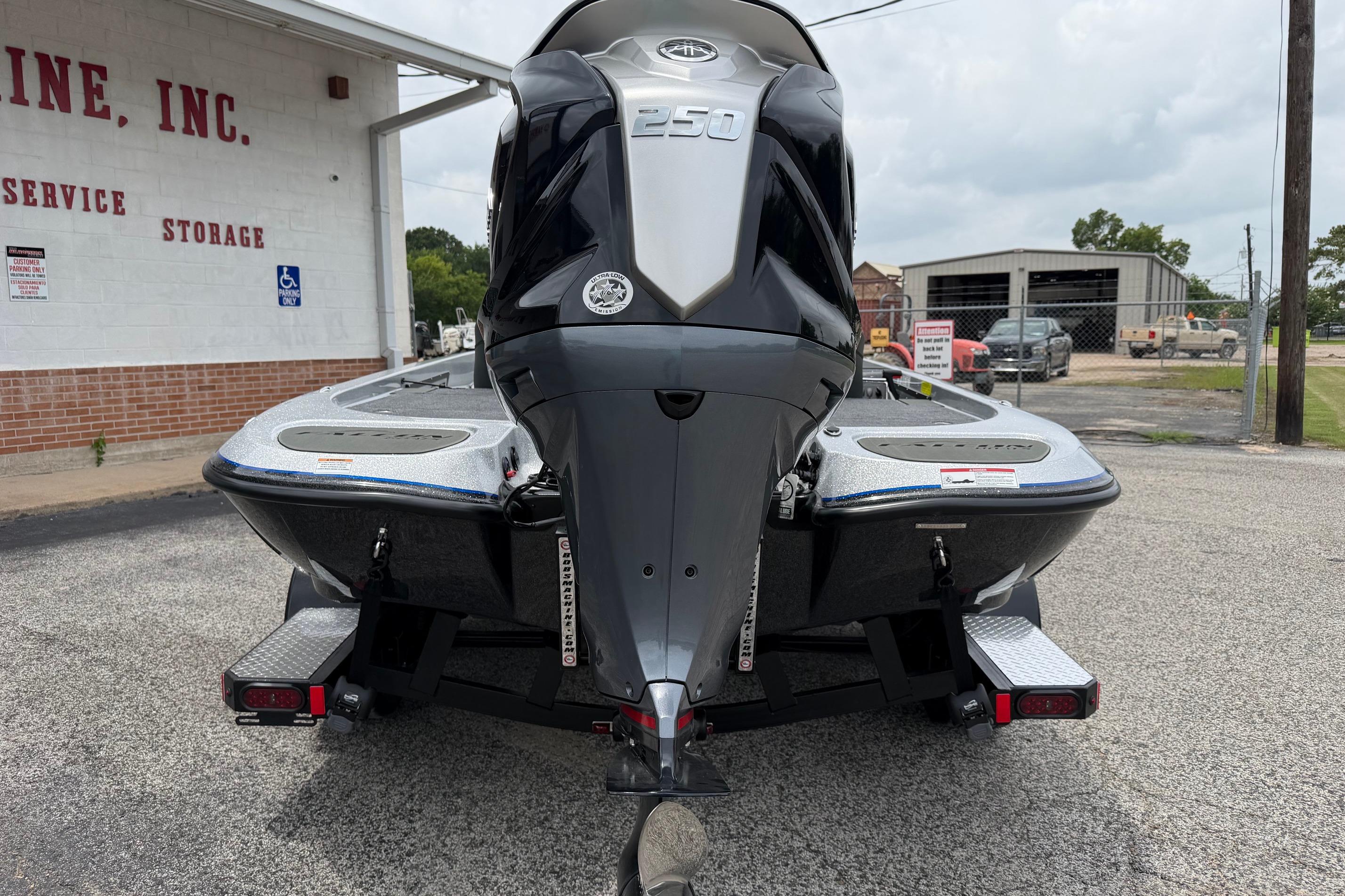 2027 Falcon F20 PREDATOR boat with powerful engine, parked outside a service facility.