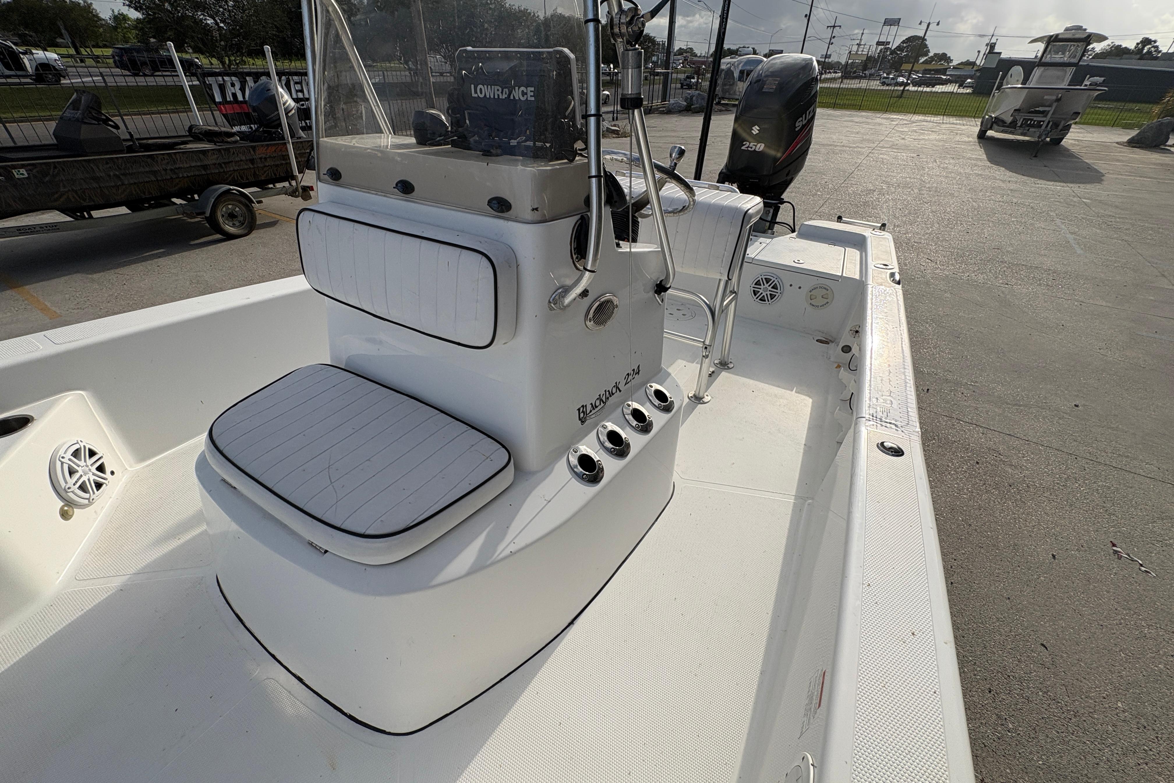 2012 BlackJack 224 boat interior with seating and control panel.
