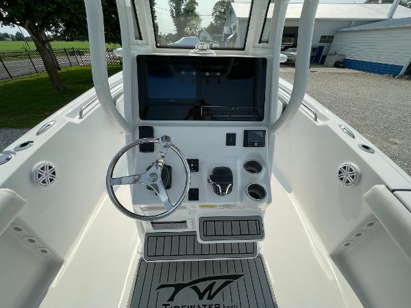 2025 Tidewater 232 CC Adventure boat console with steering wheel and controls.