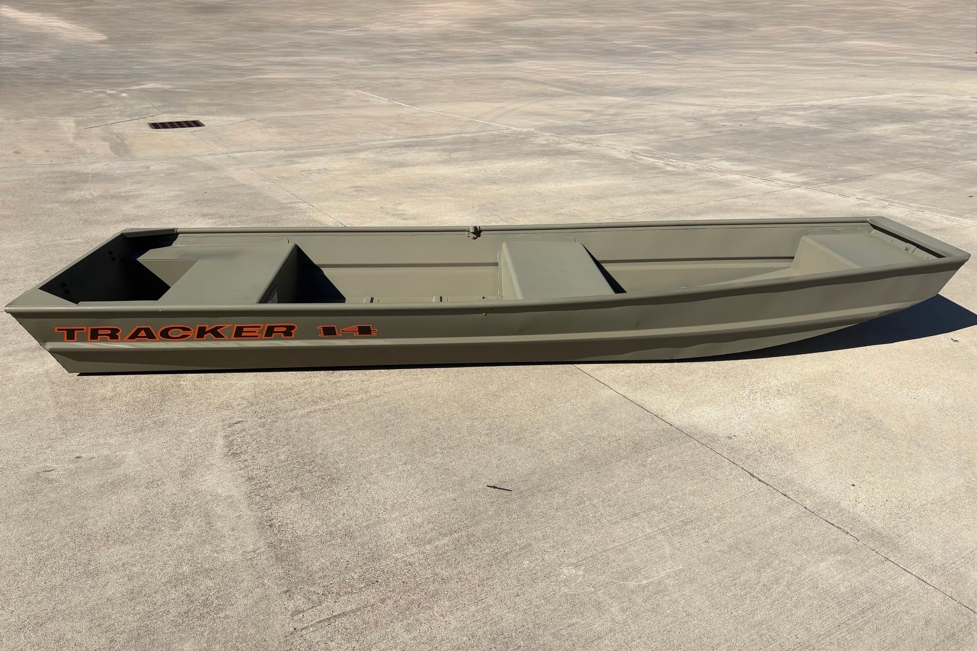 2026 Tracker Grizzly 14 Jon boat on concrete surface, showcasing its sleek design.