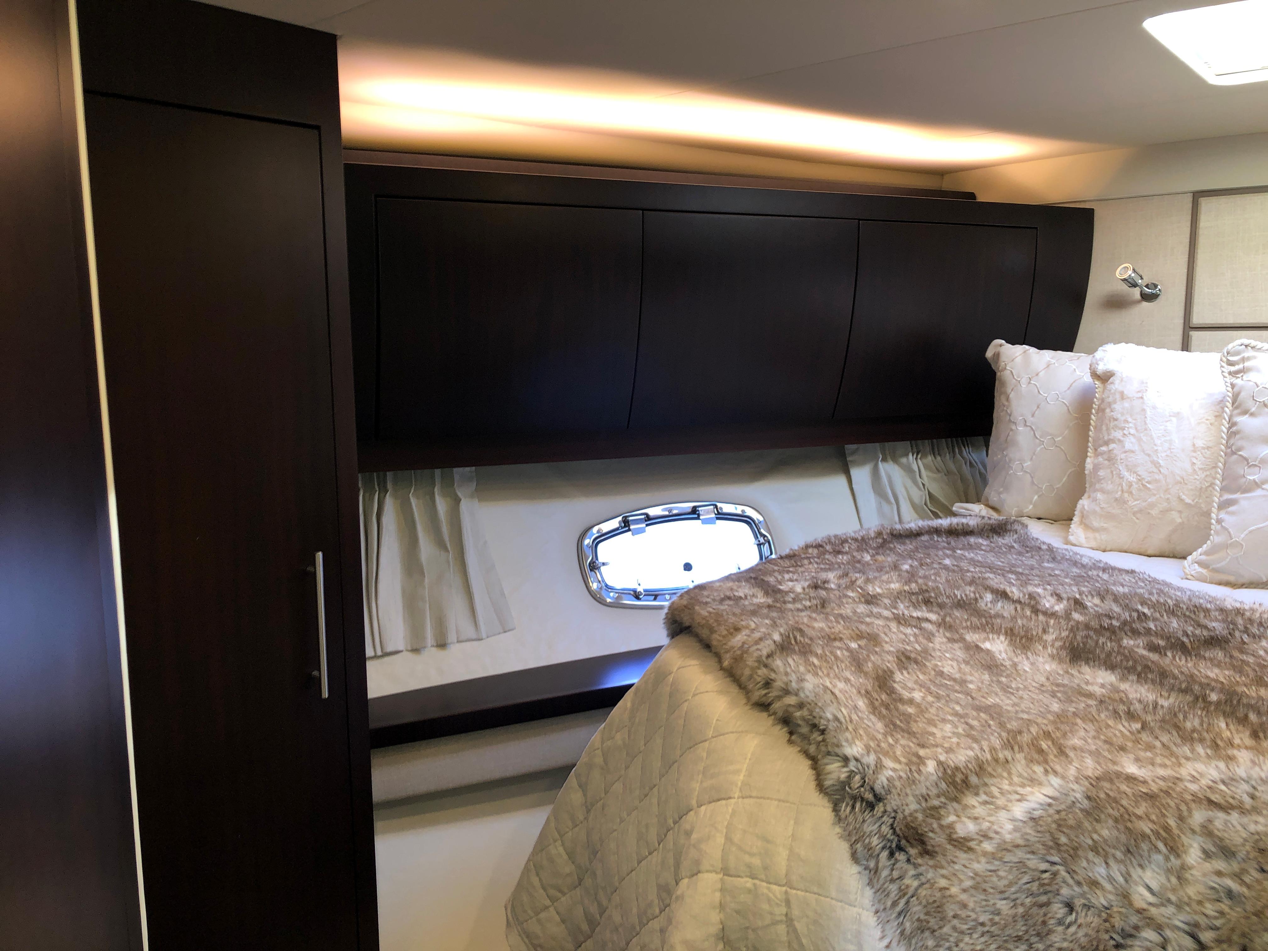Luxurious bedroom interior of 2017 Regal 53 Sport Coupe yacht.