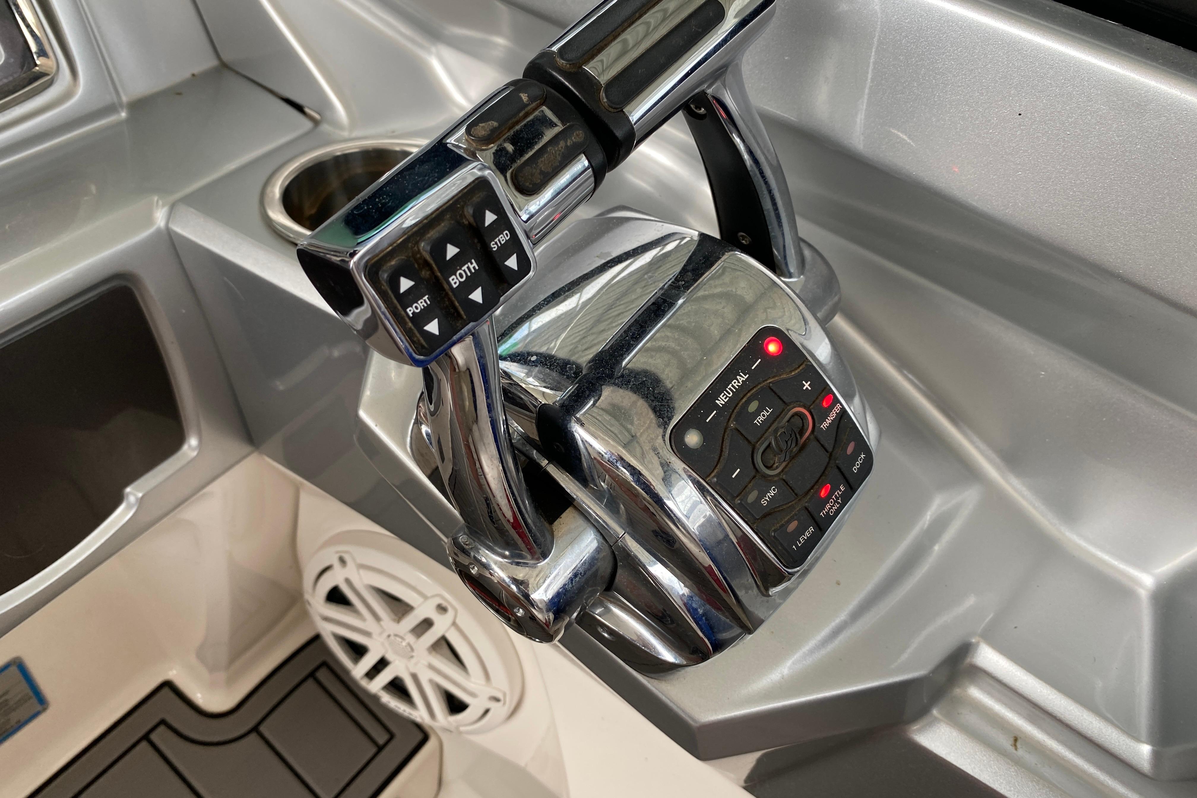 Control panel of a 2012 Chaparral 327 SSX boat with chrome throttle levers.