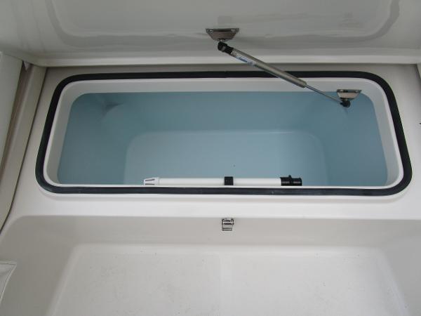 Open storage compartment of 2024 Ranger 2360 Bay boat.