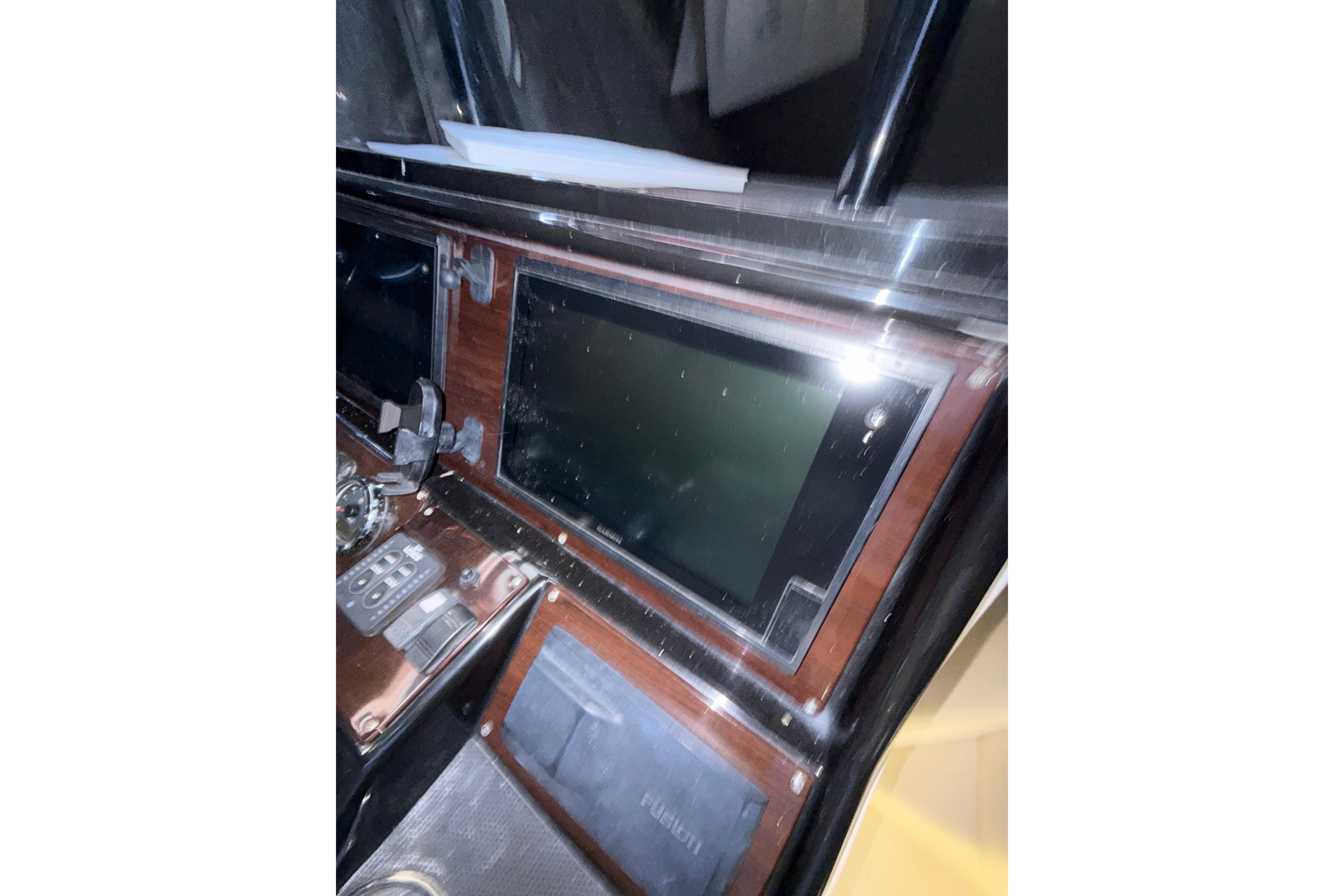 Dashboard of a 2015 Blackwood 27 boat with electronic controls and display.