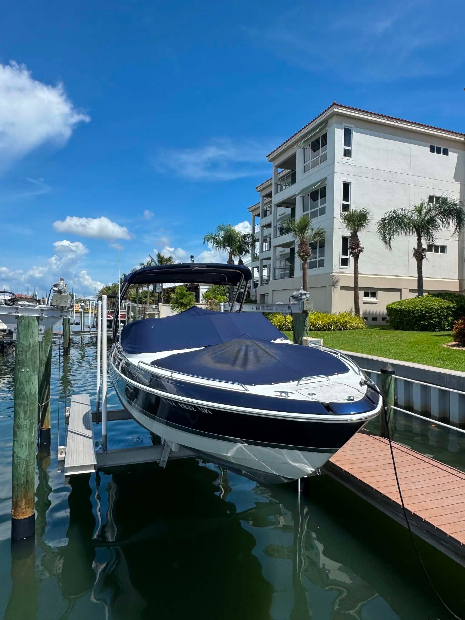 2018 Formula 270 Bowrider on a boat lift at the dock.