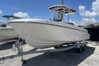 2023 Trophy T24 CC boat on trailer under clear blue sky.