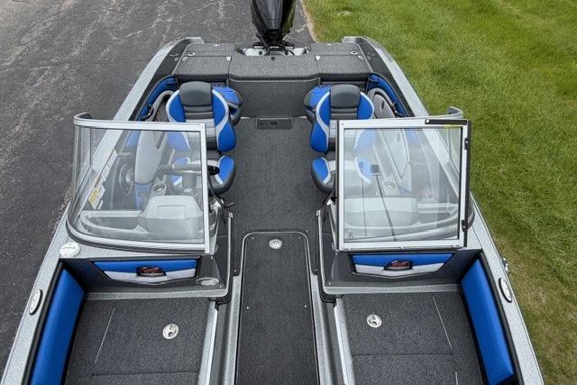 2025 Ranger 1850MS boat interior with blue and gray seating, open windshield, and spacious layout.