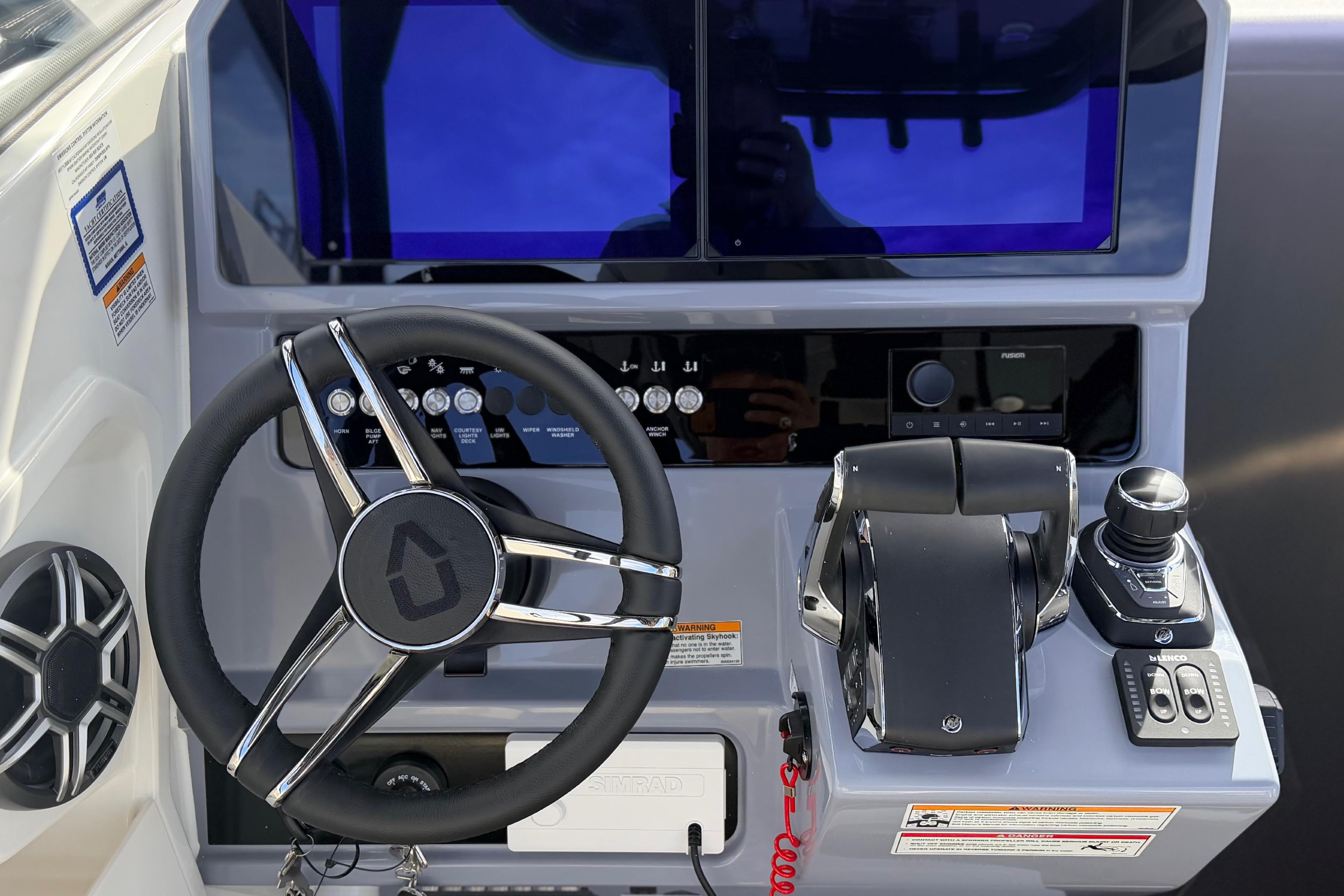 Steering console of 2026 Navan S30 boat with advanced controls and displays.