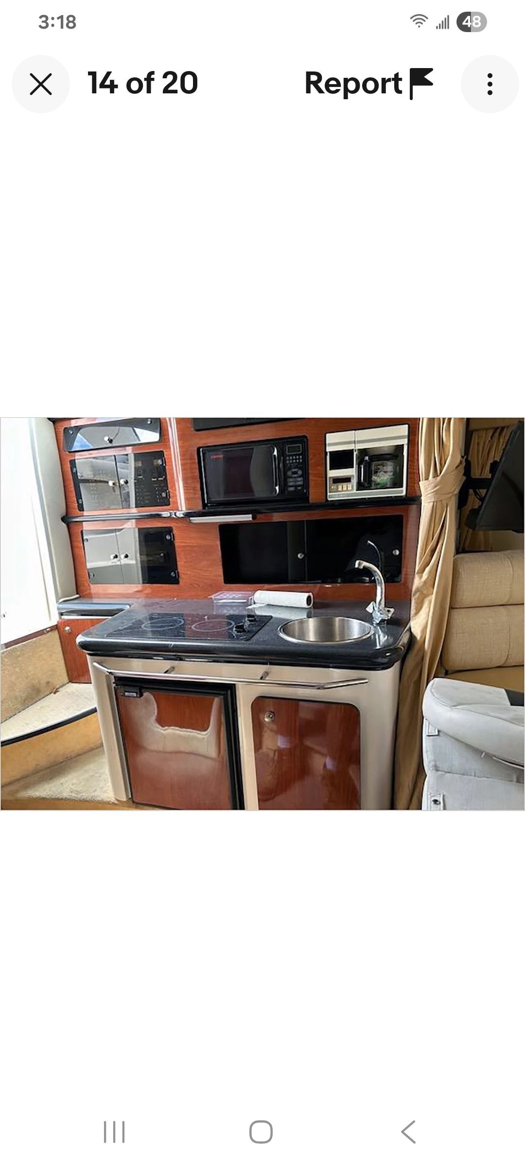 Galley area of a Monterey 290 Cruiser with sink and appliances.