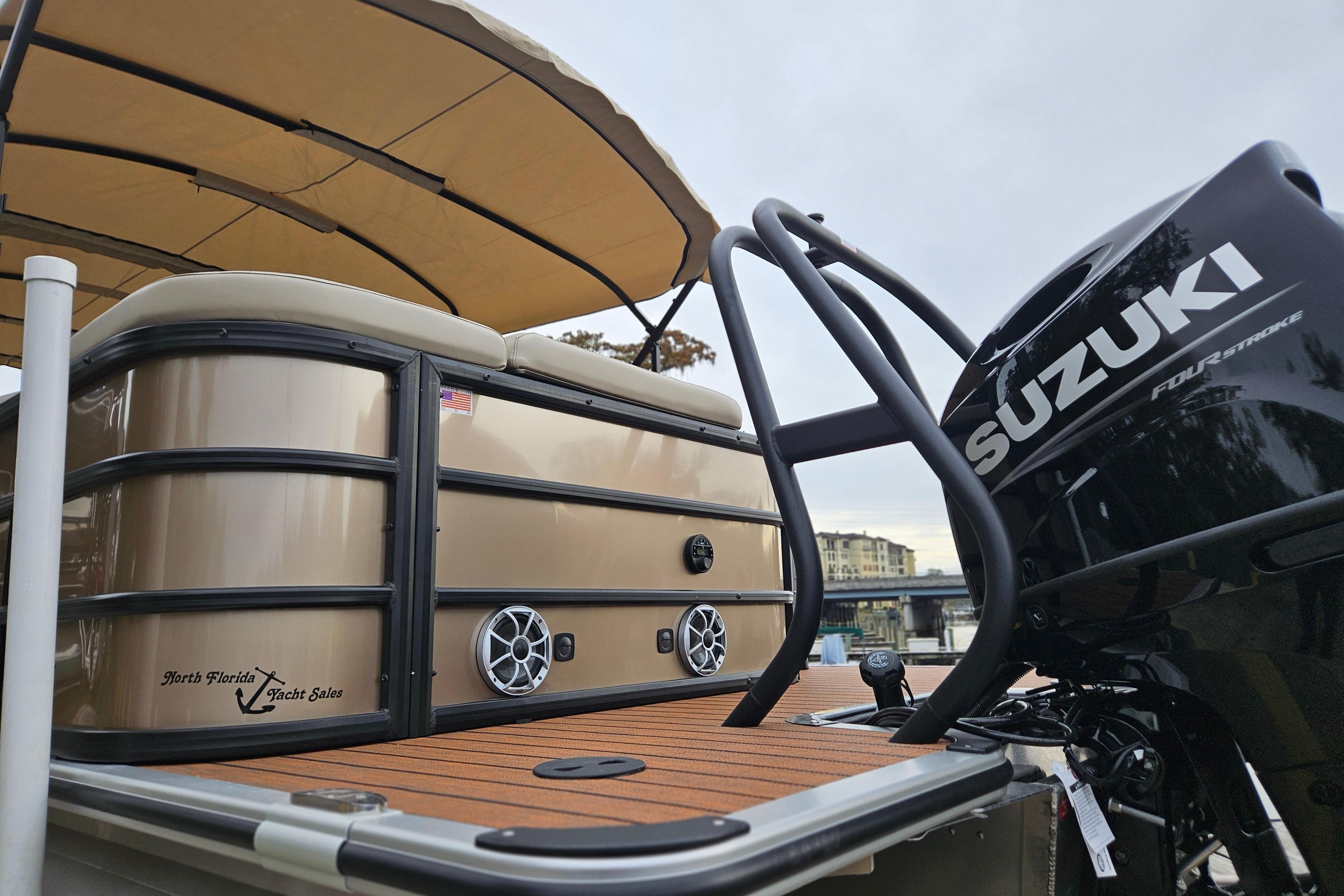 2026 Bentley Pontoons Legacy 243 Cruise with Suzuki engine, featuring a sleek design and spacious deck.