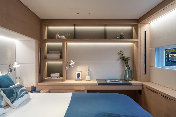 Luxurious interior of 2025 Lagoon SIXTY 5 yacht cabin with modern decor and ambient lighting.
