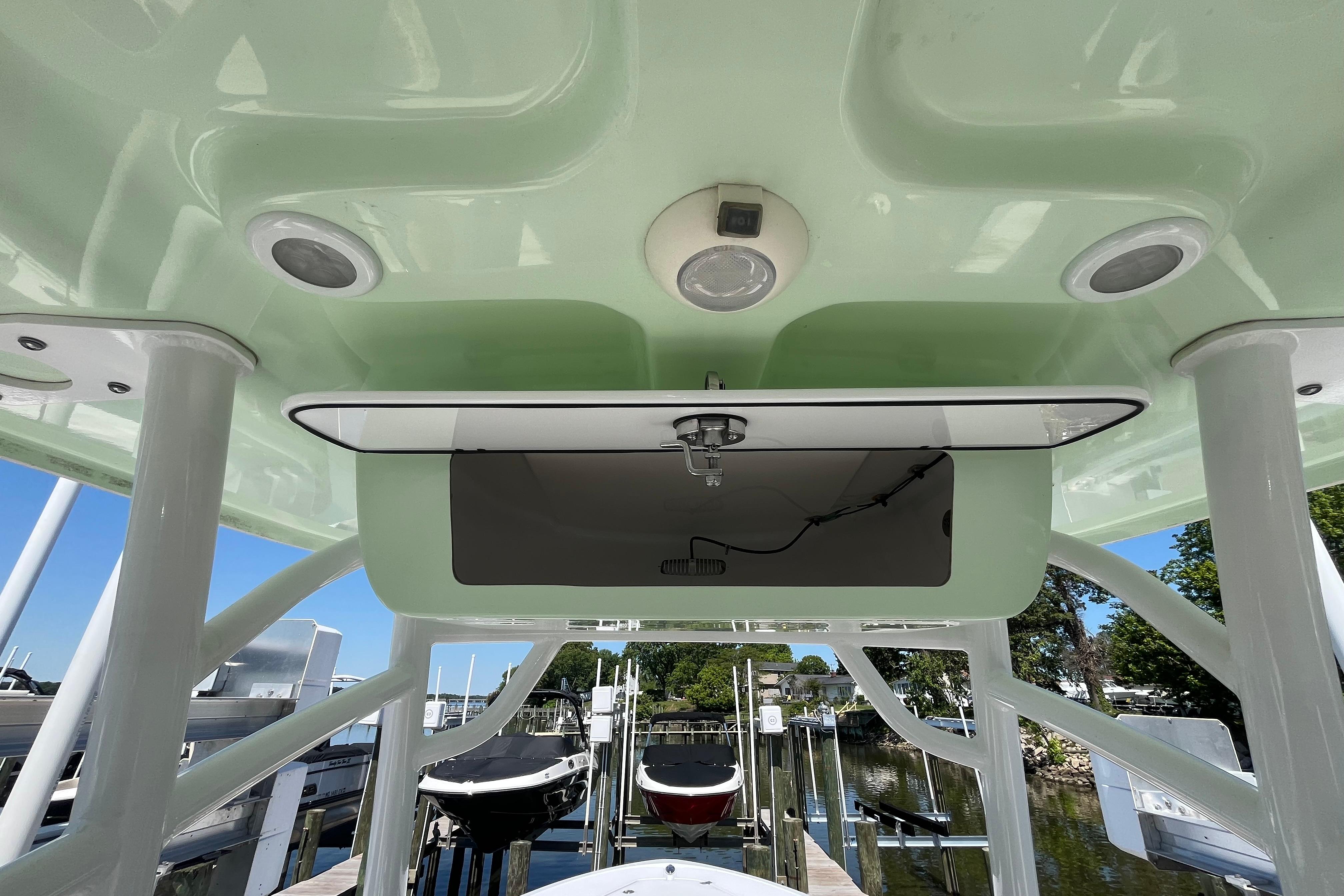 2021 Sportsman Heritage 231 Center Console boat interior with speakers and storage compartment.
