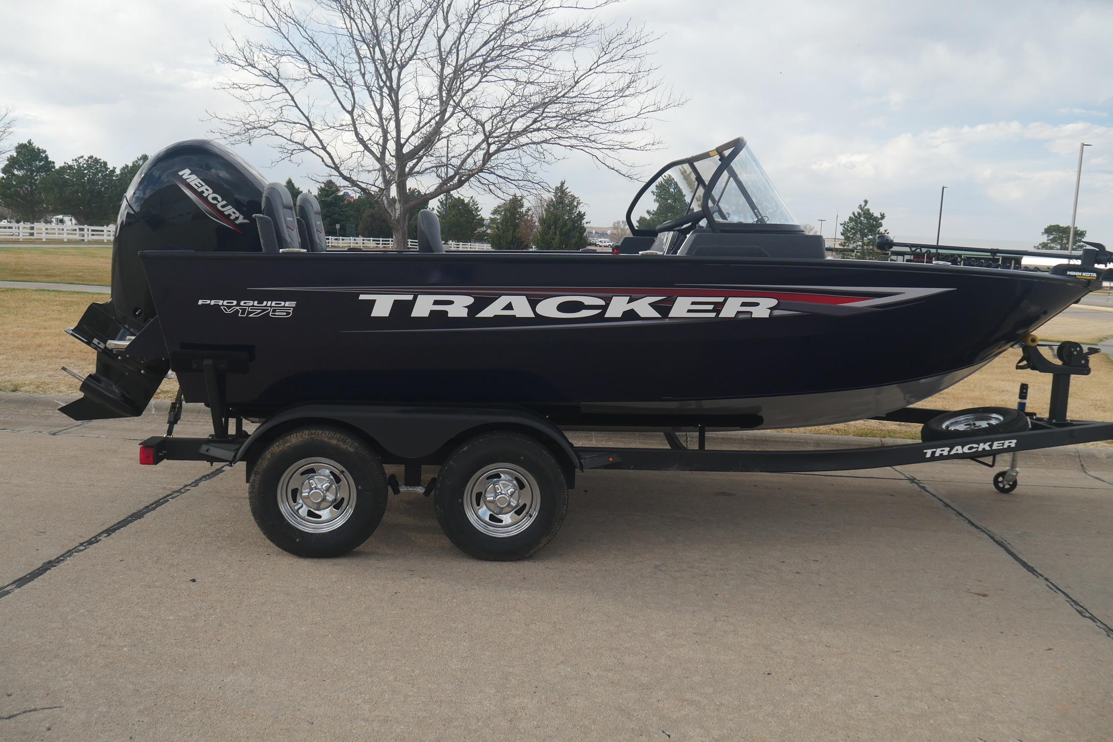 2026 Tracker Pro Guide V-175 Combo boat on trailer, parked outdoors.