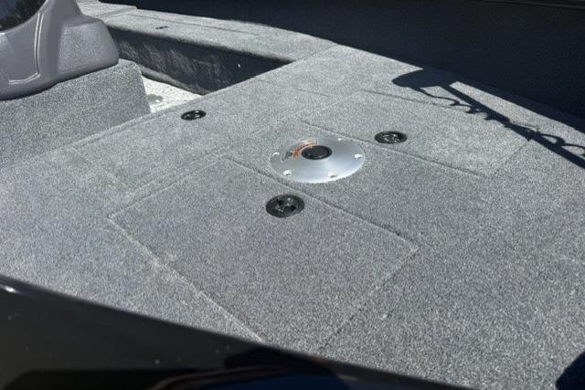 2026 Tracker Super Guide V-16 SC boat interior with gray carpeted deck.