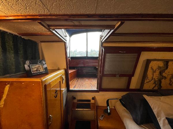 1951 Chris-Craft Catalina interior with wood paneling and vintage decor.