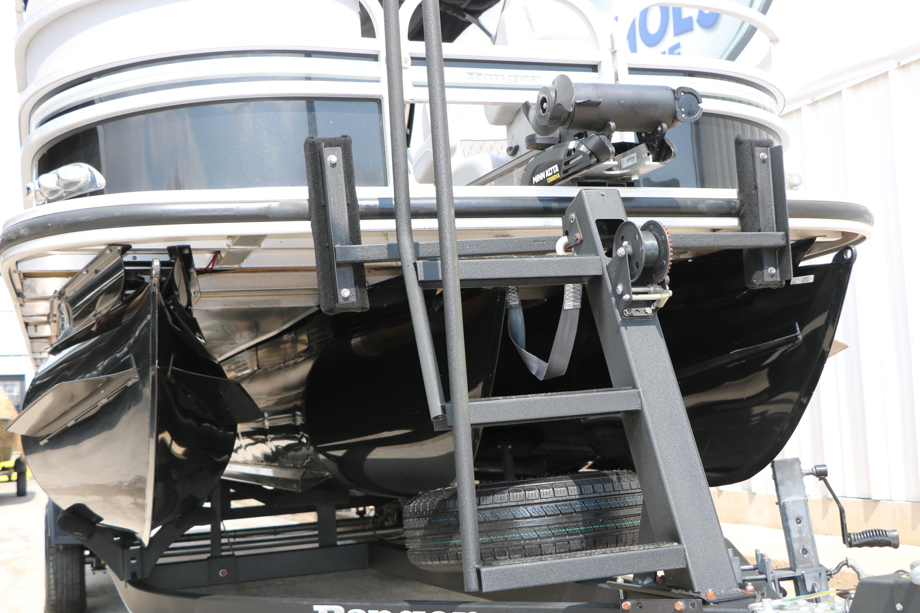 2021 Ranger 223FC boat on trailer, featuring a black hull and mounted equipment.
