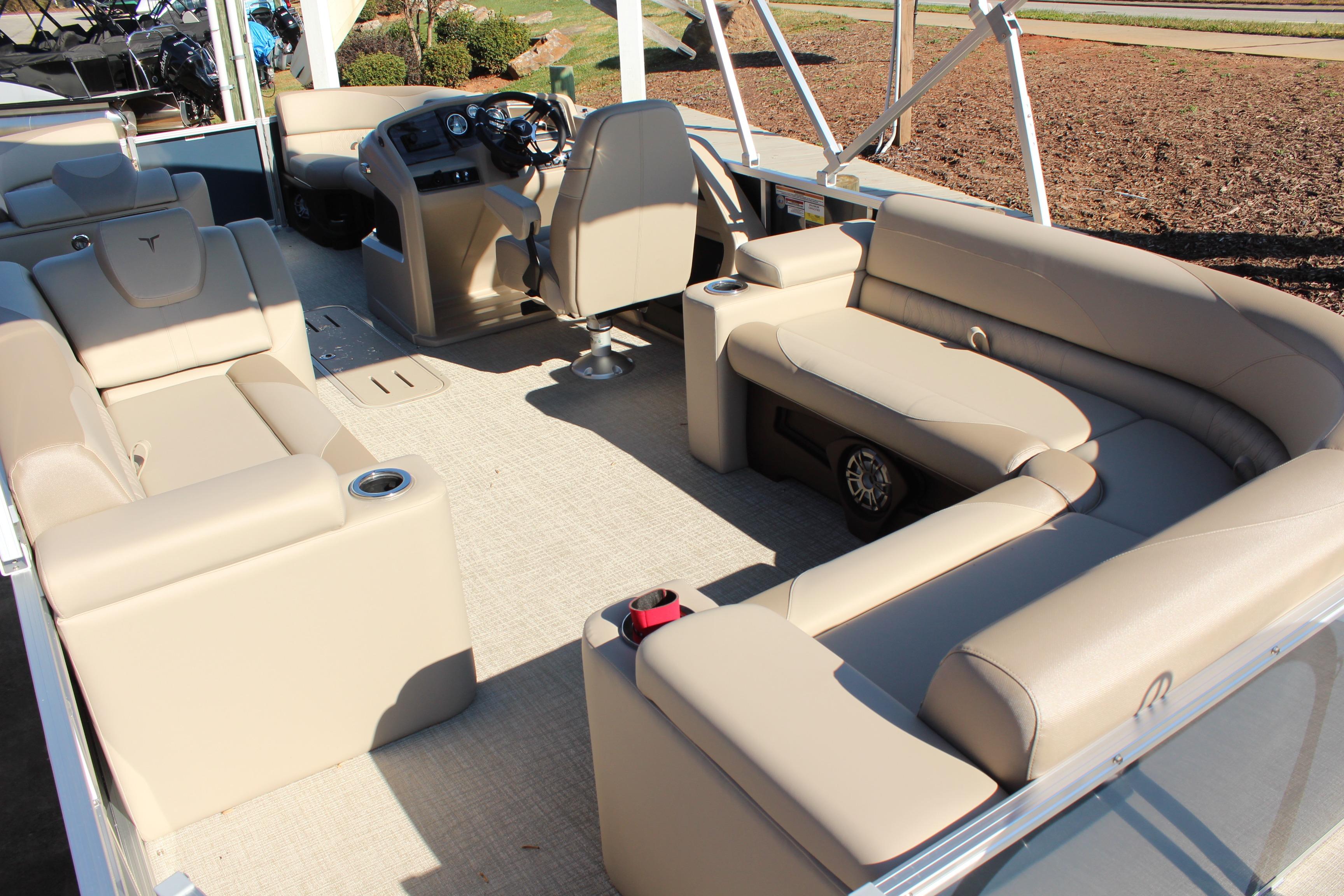 2026 Tahoe Pontoon LTZ Elite interior with beige seating and modern dashboard.