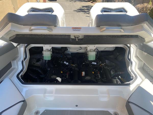 2025 Scarab 235 SE engine compartment with open hatch, showcasing dual engines.