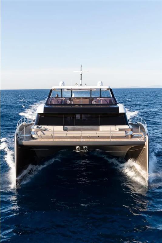 Luxury 2026 Sunreef 80 Power yacht cruising on open sea.
