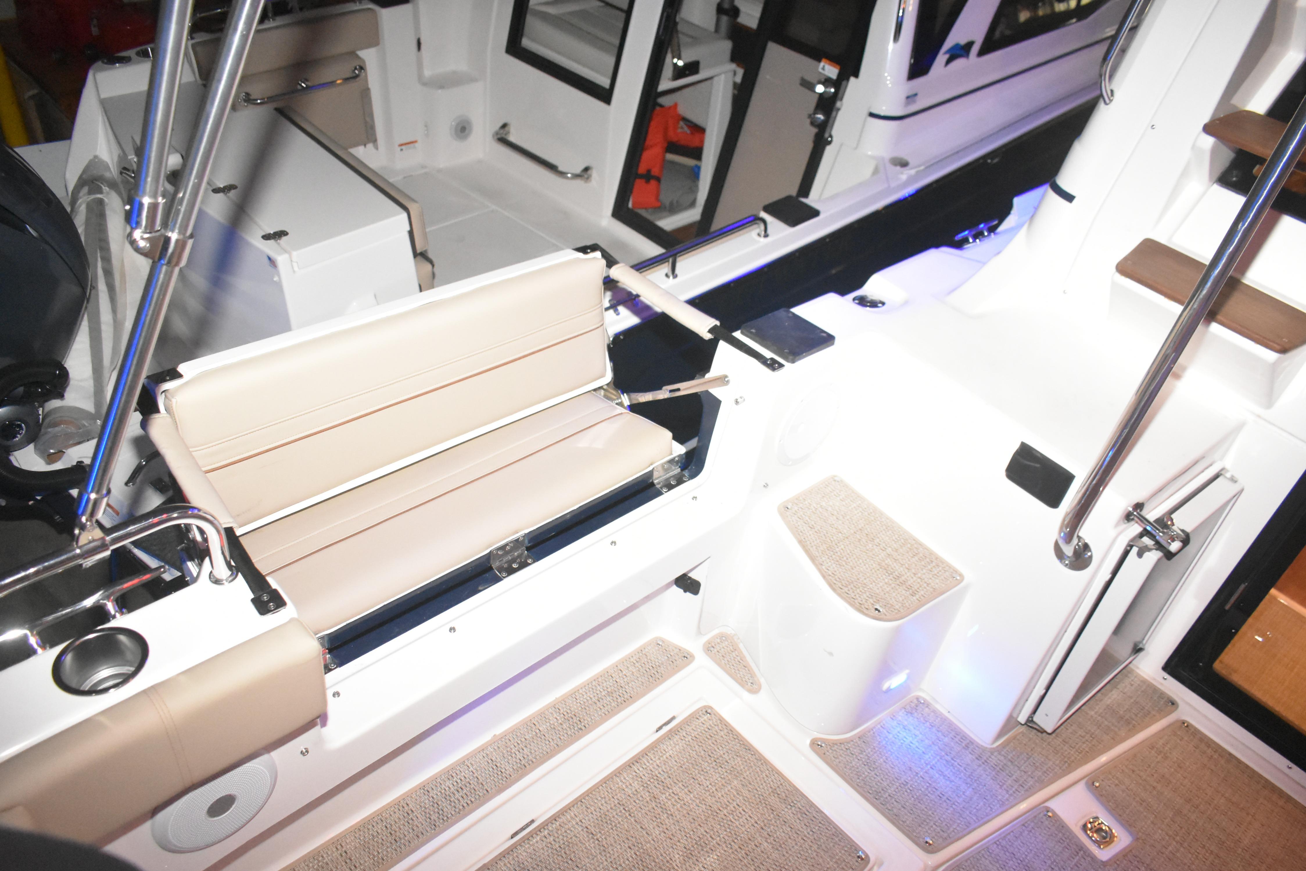 Interior view of 2026 Cutwater C-32 CB boat, featuring seating and modern design elements.
