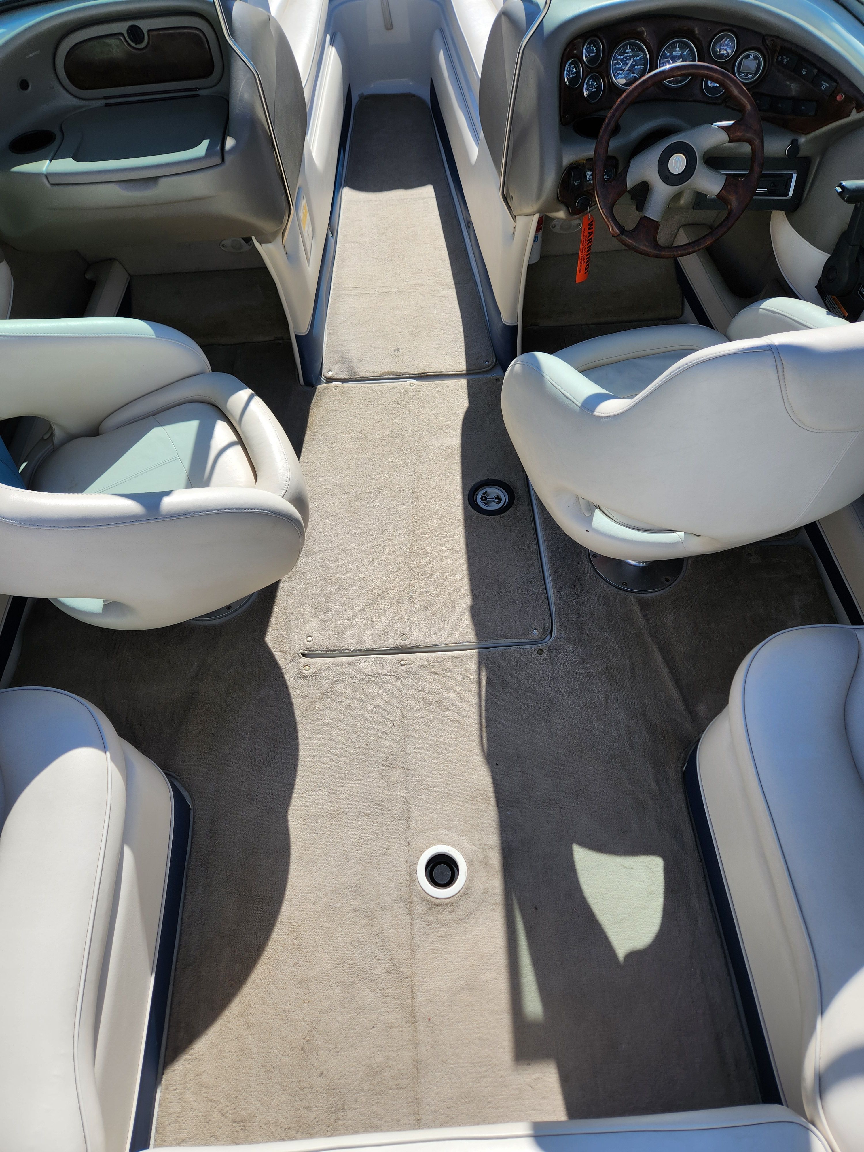 Interior of a 2003 Crownline 225 BR boat with gray seating.