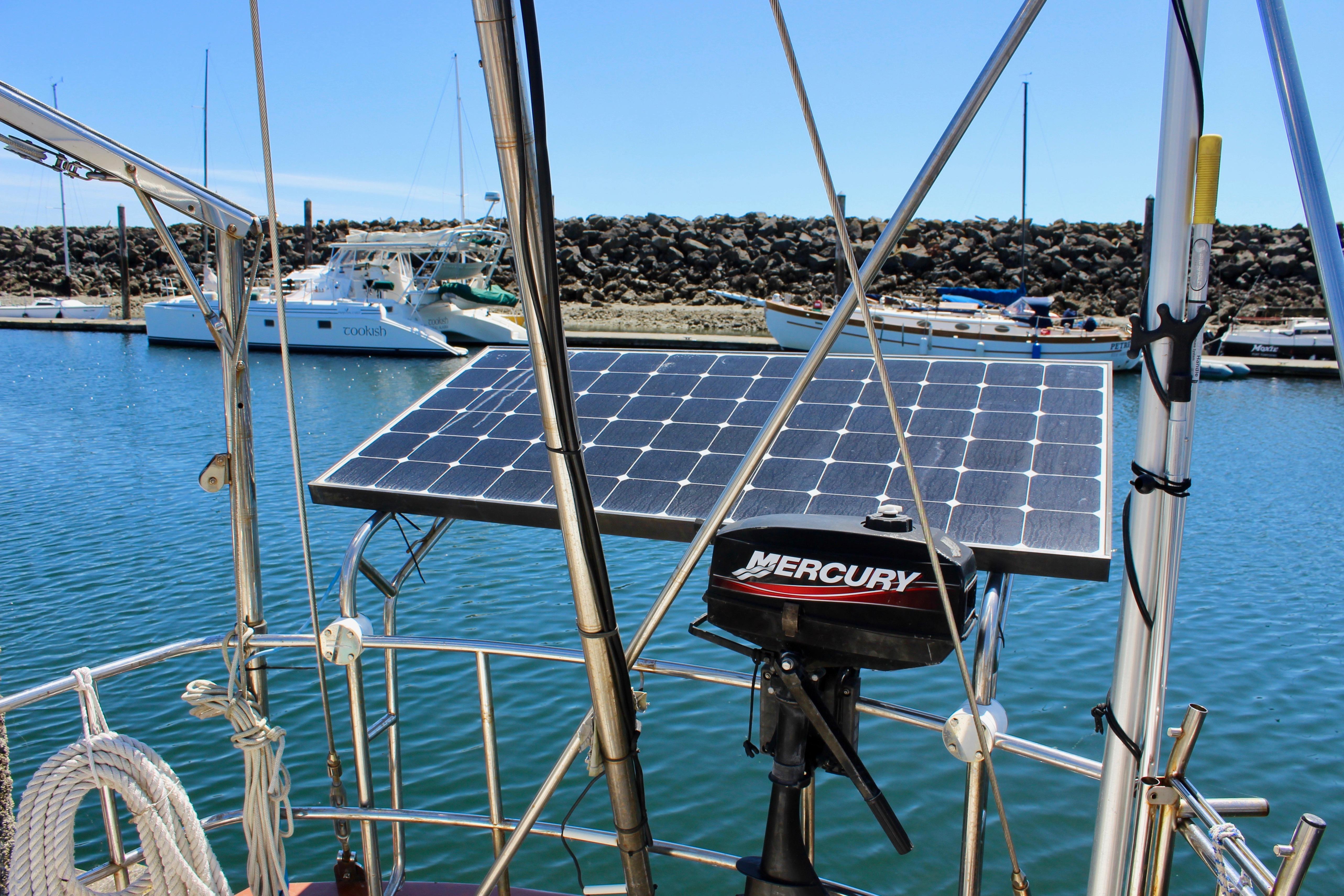 Sailboat with solar panel and Mercury motor in marina, Kelly Peterson 46, 1981 model.
