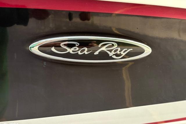 2017 Searay SPX210 boat logo on sleek black and red exterior.