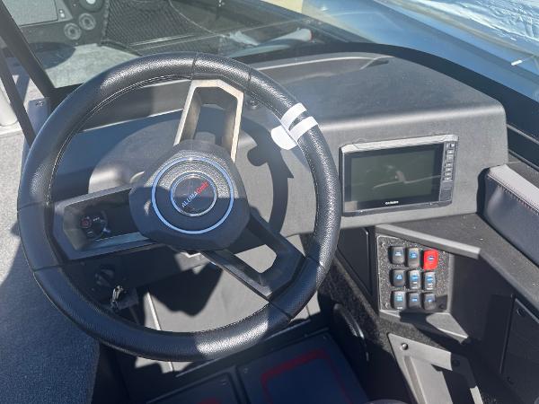 2025 Alumacraft Trophy 185X SC Rotax S dashboard with steering wheel and control panel.