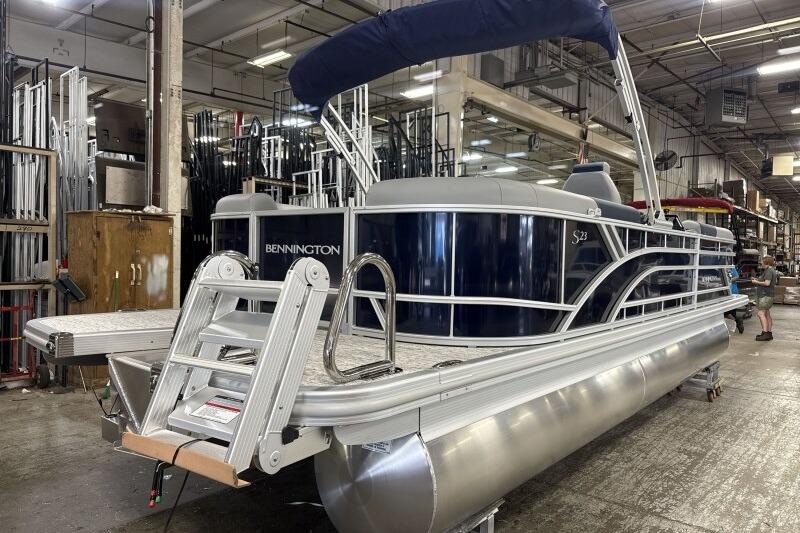 2026 Bennington 23 SSRSF pontoon boat in a factory setting.