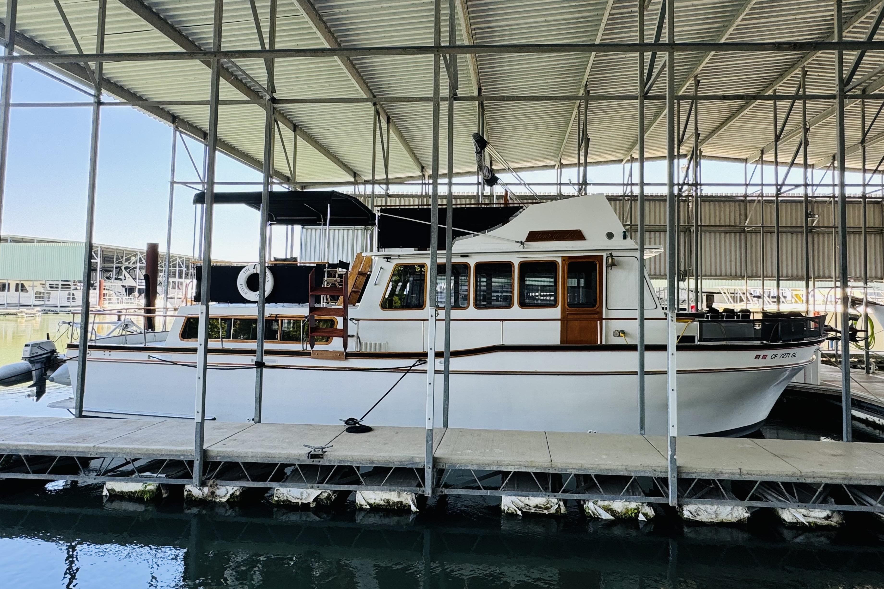 1978 Californian 42 LRC yacht docked in a covered marina.