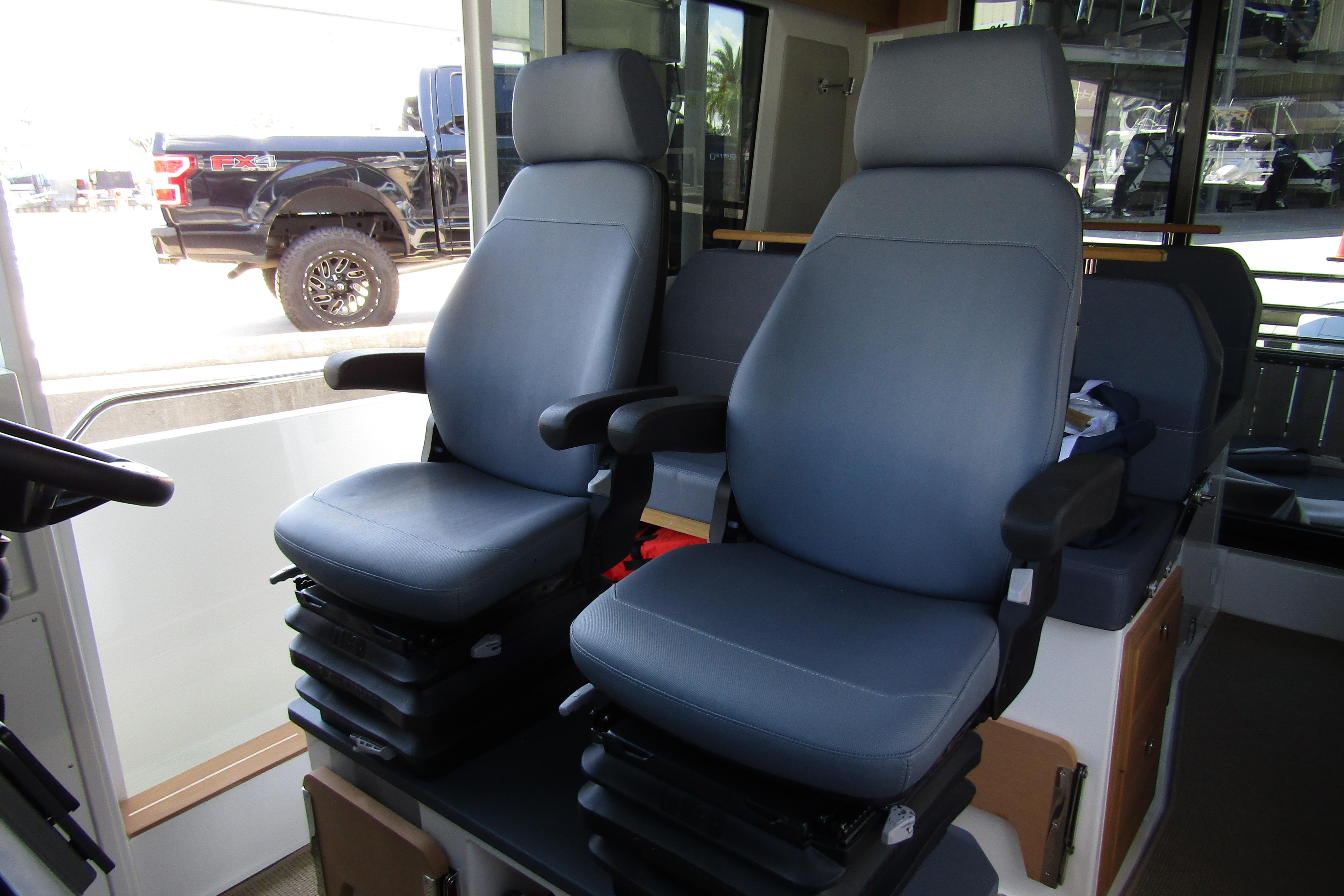 Interior of 2024 Nimbus Commuter 11 with two ergonomic seats.