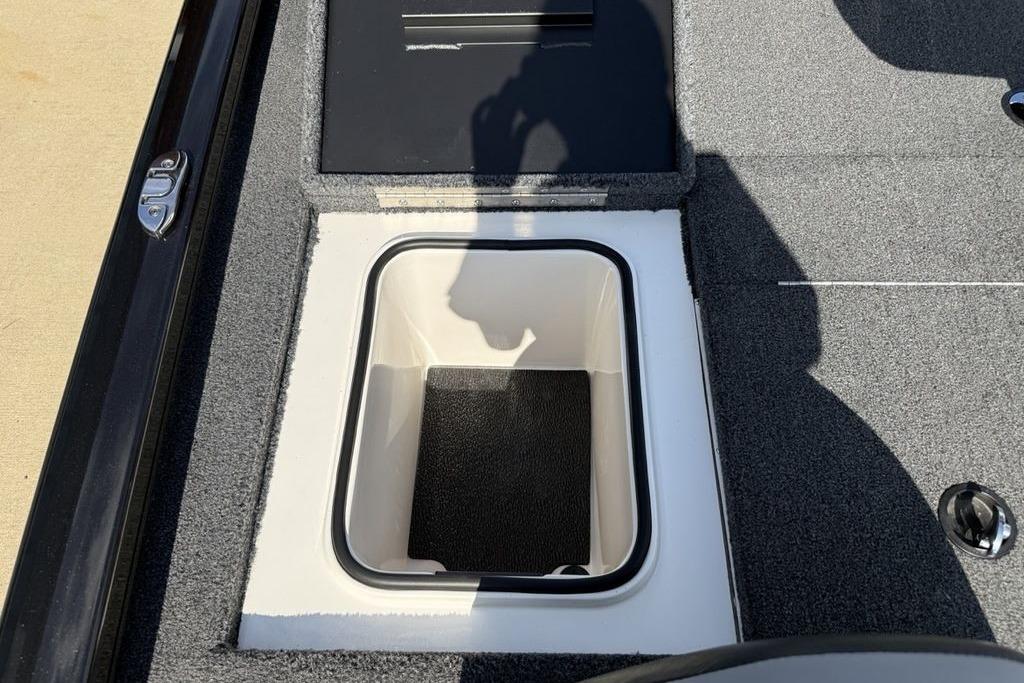 2023 Vexus AVX189 boat storage compartment with open lid, showcasing interior design.