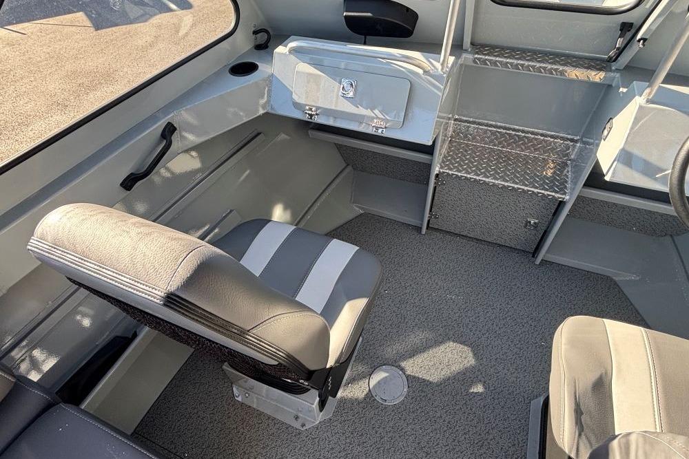 Interior of 2025 Hewescraft 200 ProV ET boat with seating and storage.