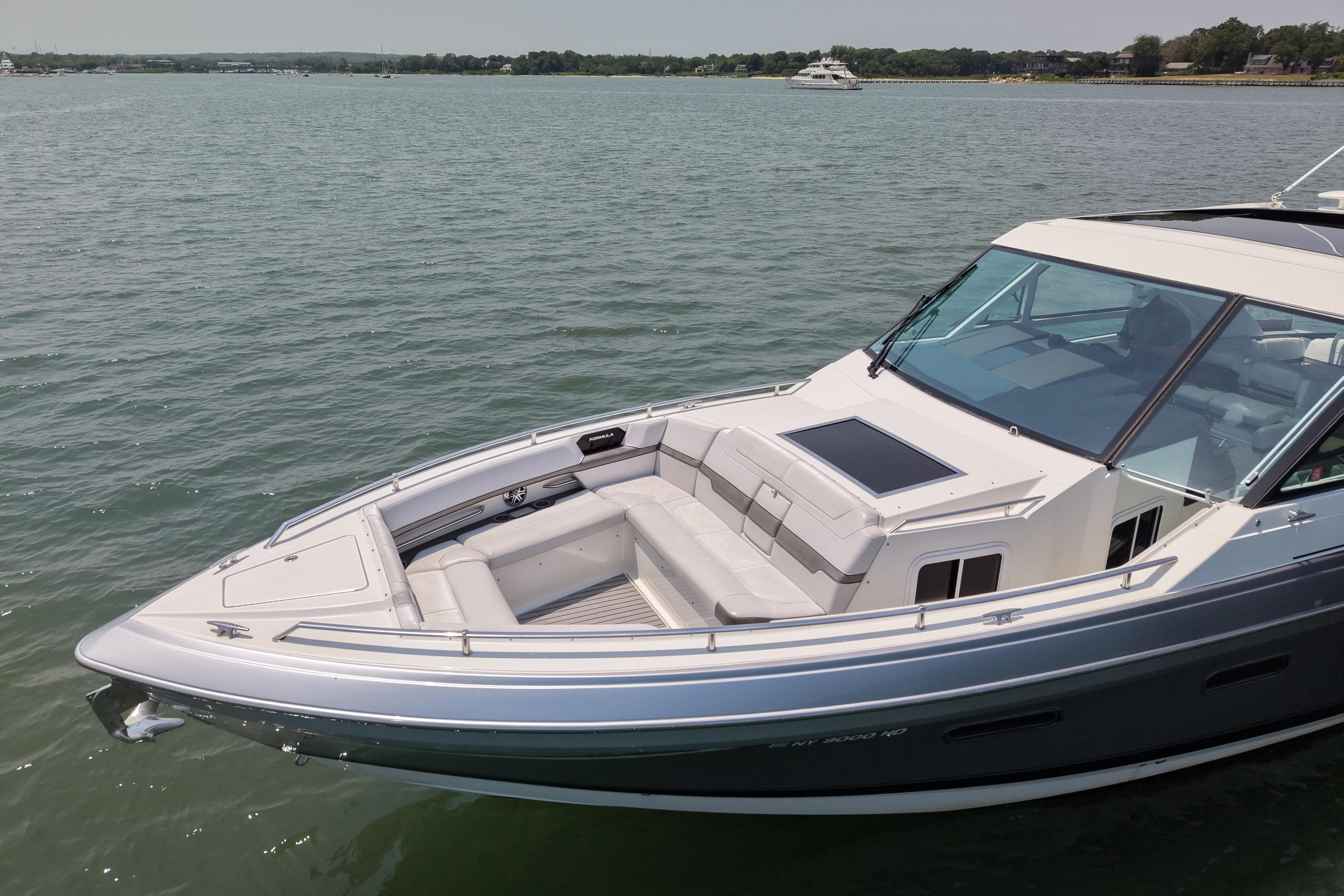 2019 Formula 430 Super Sport Crossover boat on calm water, showcasing sleek design.