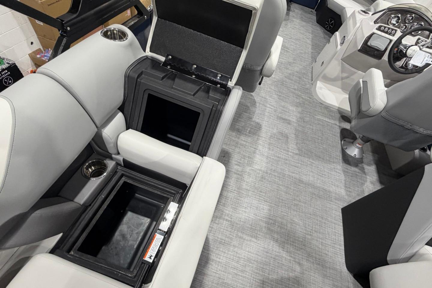 Interior of 2026 Lowe SS 230 WT boat with open storage compartments and modern seating.
