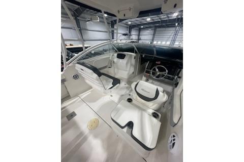 2022 Robalo R247 Dual Console boat interior with modern seating and steering wheel.