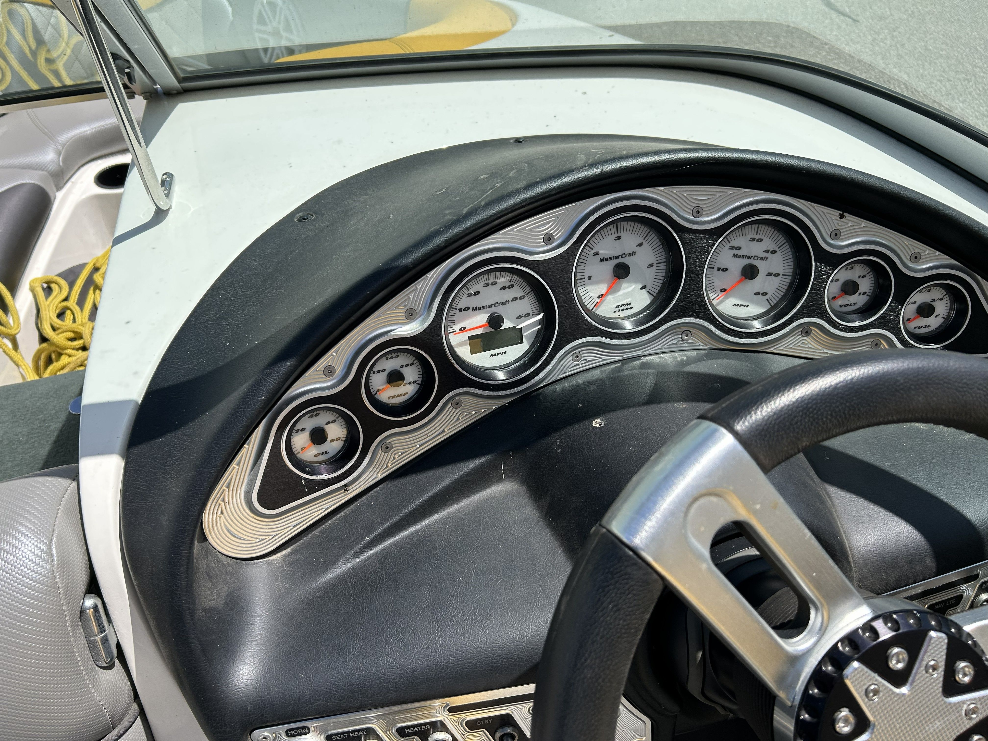 Dashboard of a 2011 MasterCraft PS197 boat with gauges.