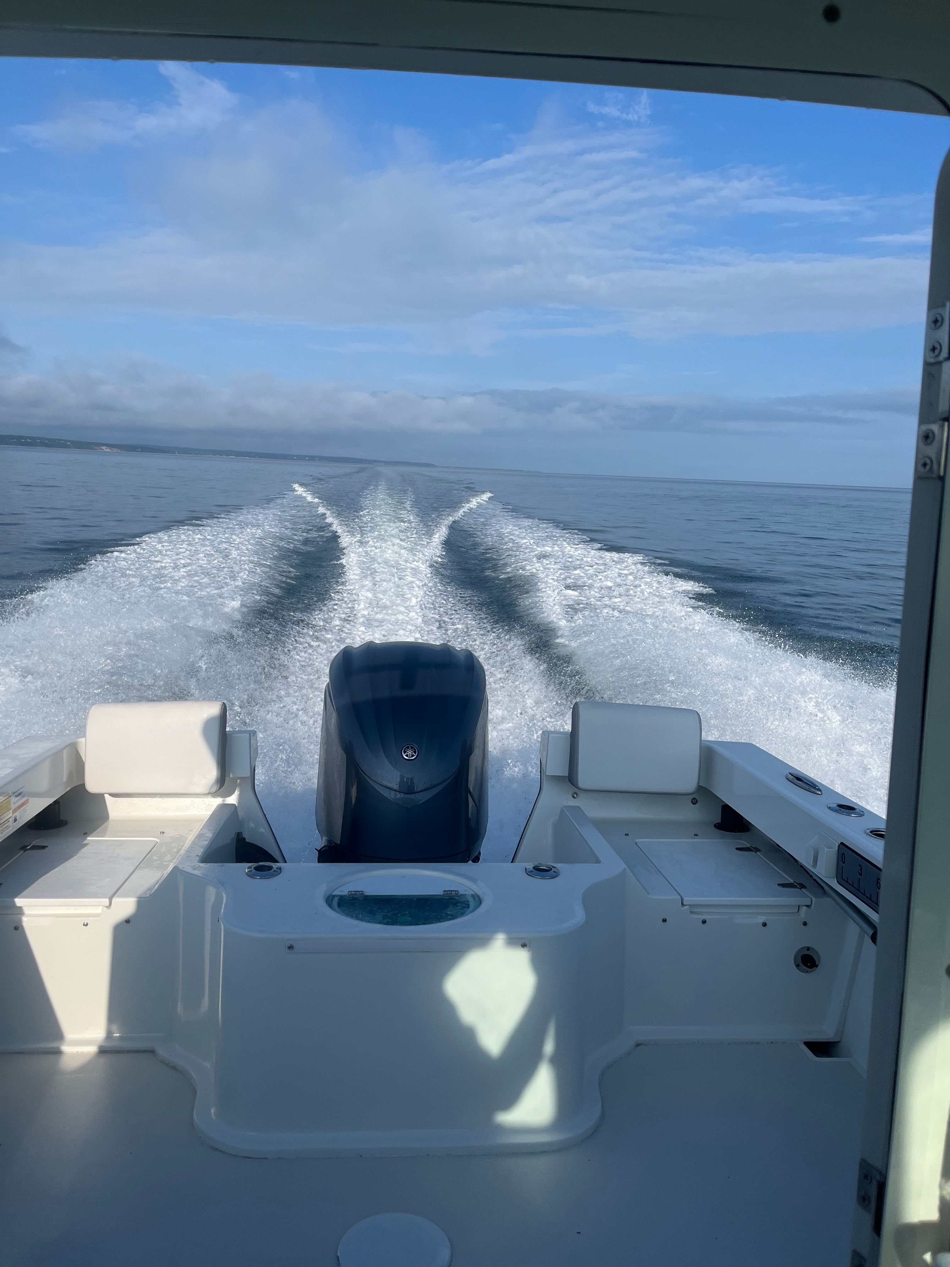 View from the cabin of a Parker 2021 sport cabin boat looking out to open sea.
