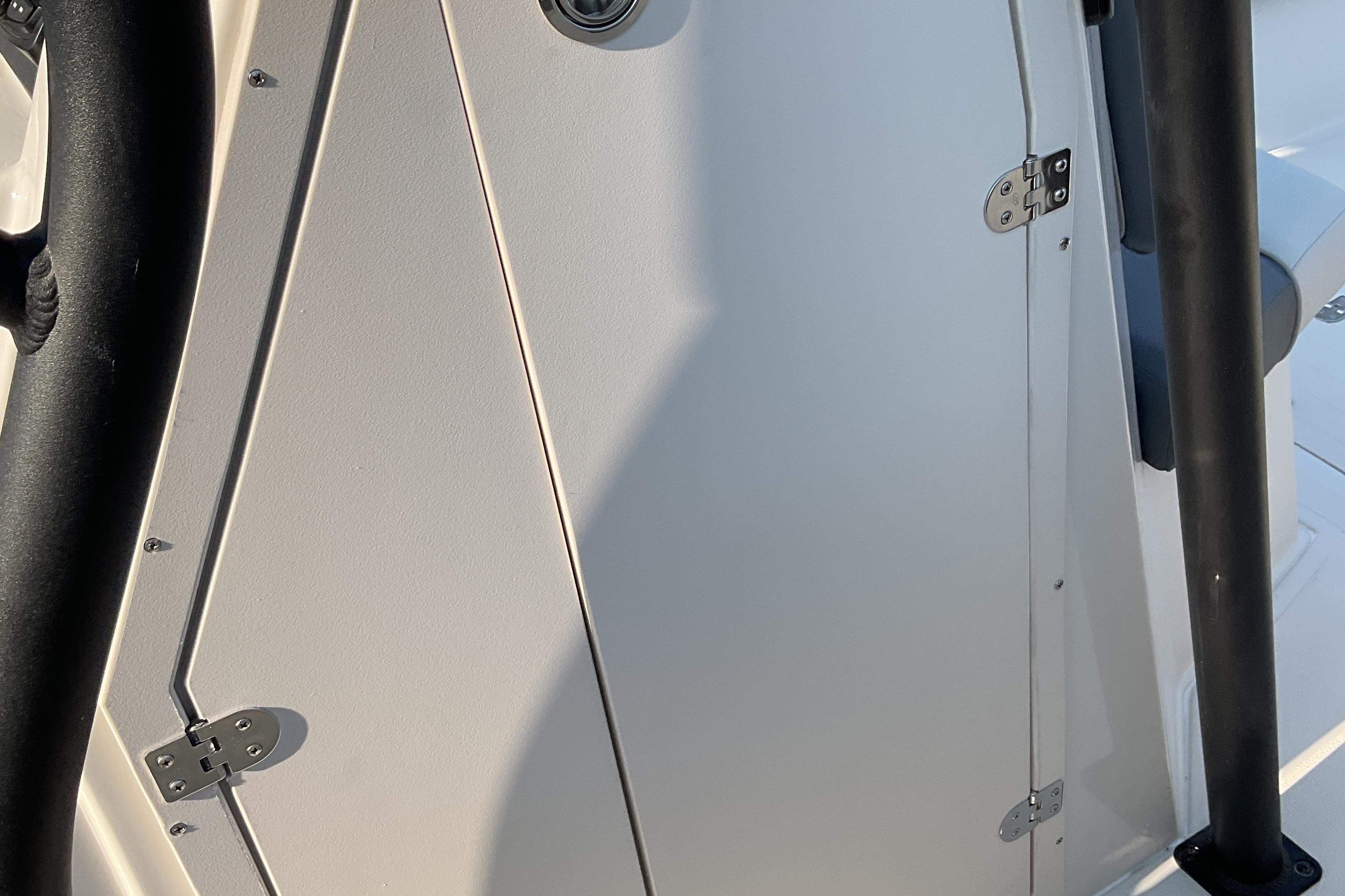 2026 Starcraft SVX 231 OB CC boat interior detail with hinges and railing.