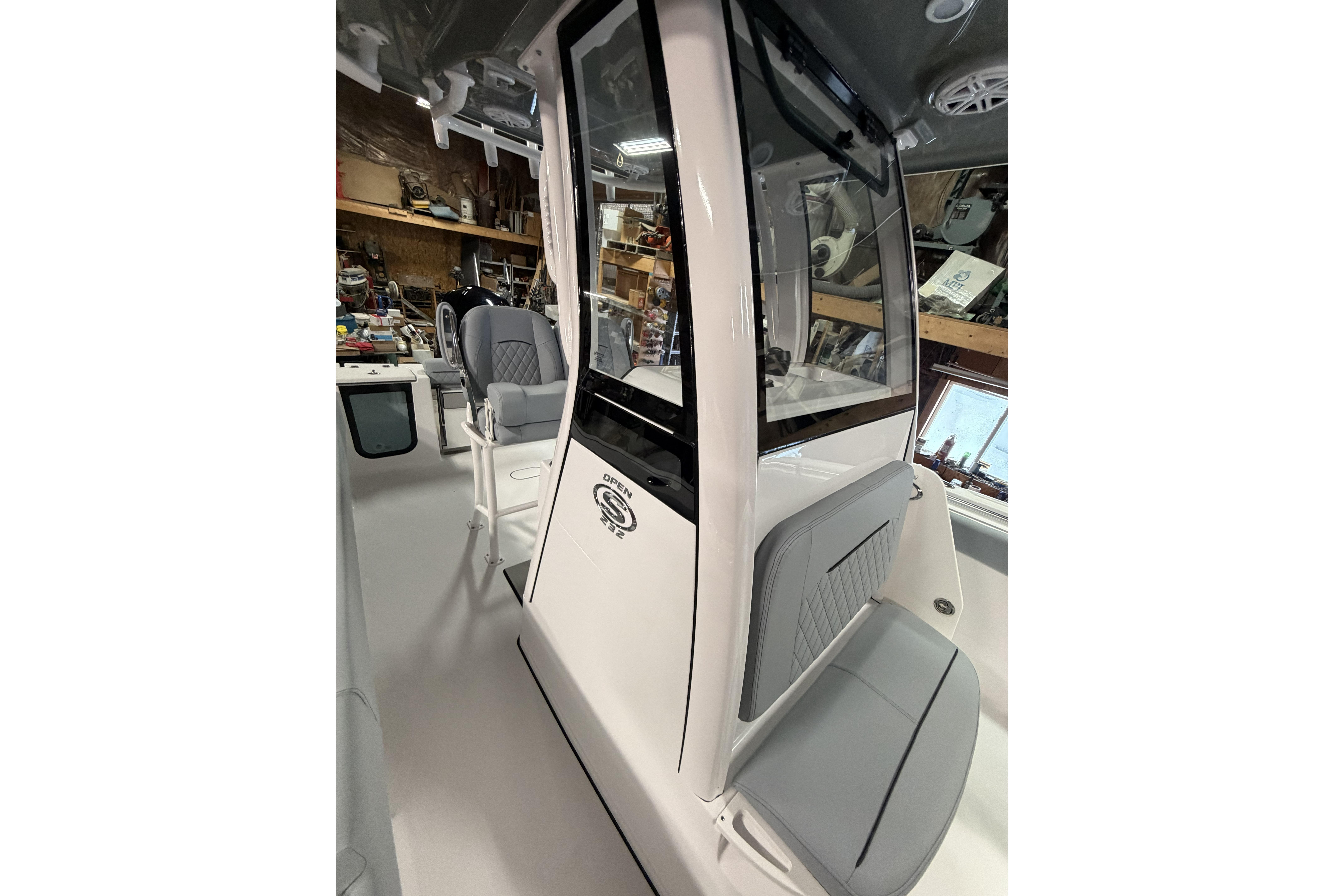 2026 Sportsman Open 232 Center Console boat interior with seating and console details.