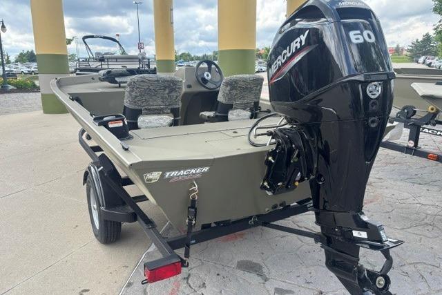 2026 Tracker Grizzly 1754 SC boat with Mercury 60 engine, parked outdoors.