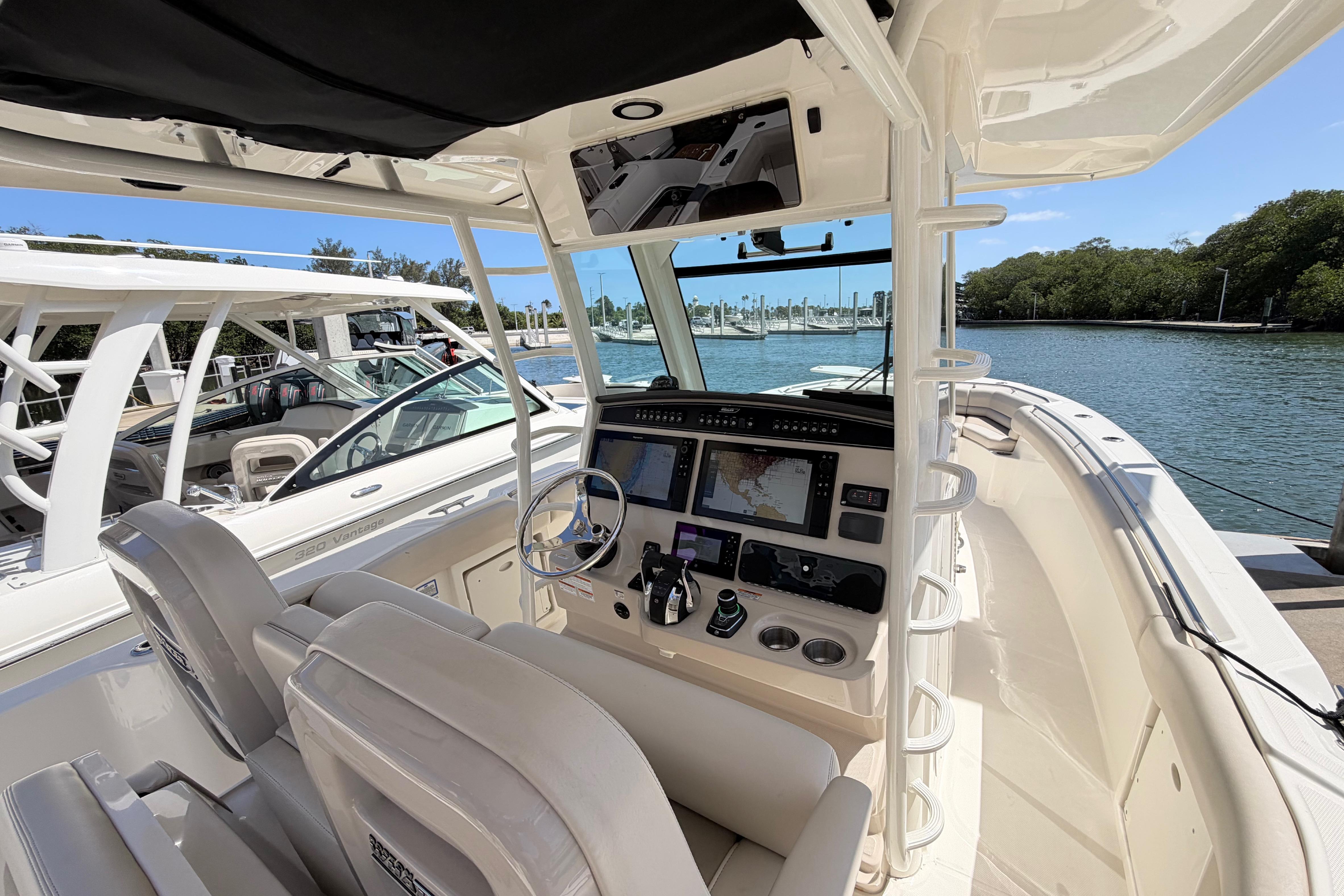 2019 Boston Whaler 330 Outrage boat interior with navigation system and helm controls.